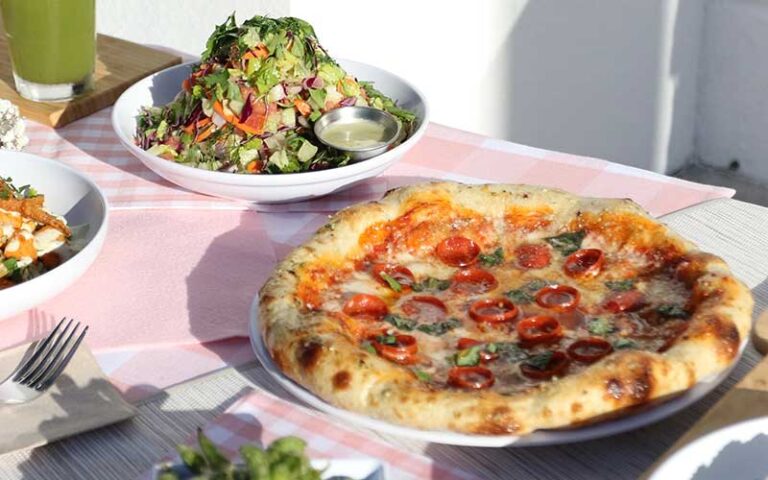 pizza and salad on outdoor table at cali tampa