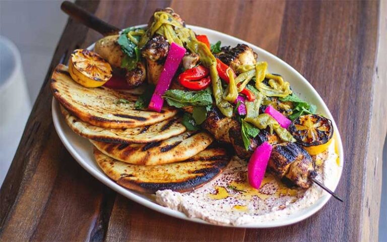 shish kabab on oval platter at eva and the oyster bar cocowalk miami