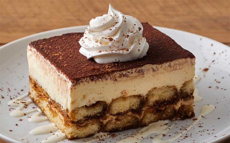 square cut tiramisu on white plate at brio italian grille tampa