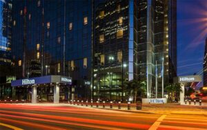 street level night exterior of base of high rise buildings at hilton tampa downtown