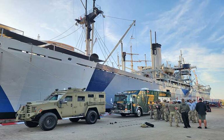 swat team training exercise along dock beside ship at american victory ship museum tampa