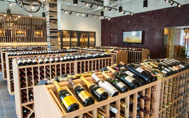 vast wine cellar with wood shelves at epicurean hotel autograph collection tampa