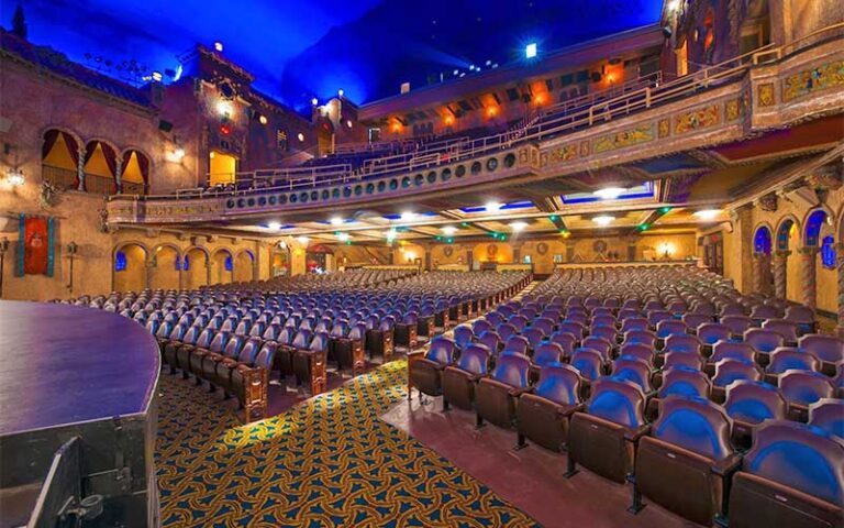 view from stage right of seating and blue night sky ceiling at tampa theatre