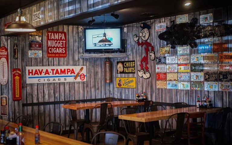 walls of diner with antique memorabilia at jimbos pit bar b q tampa