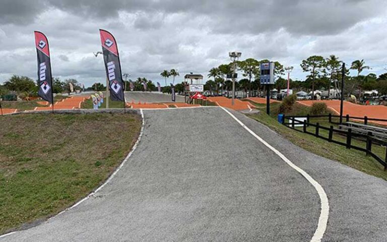 bmx bike track with rippling pavement and race signs at okeeheelee park west palm beach
