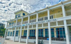 front exterior of yellow and white building at manatee lagoon west palm beach