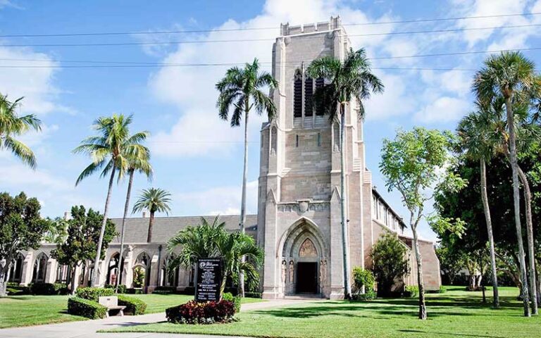 front exterior street view of church with lawn and trees at the church of bethesda by the sea west palm beach