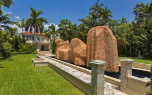 front lawn with sculptures and house in background at ann norton sculpture gardens west palm beach