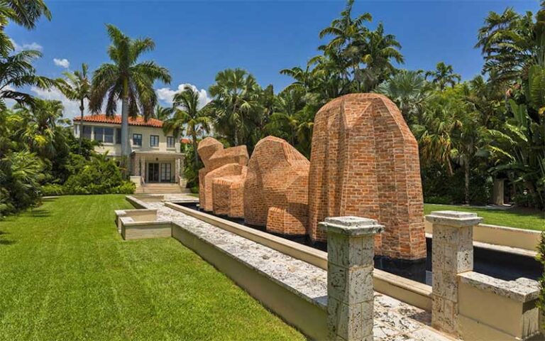 front lawn with sculptures and house in background at ann norton sculpture gardens west palm beach