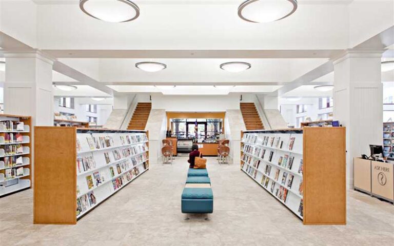 modern style book shelves with stairs leading up at mandel public library of west palm beach