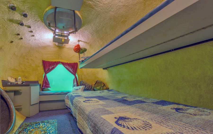 tank like bedroom with portal window hatch and bed jules underwater lodge key largo