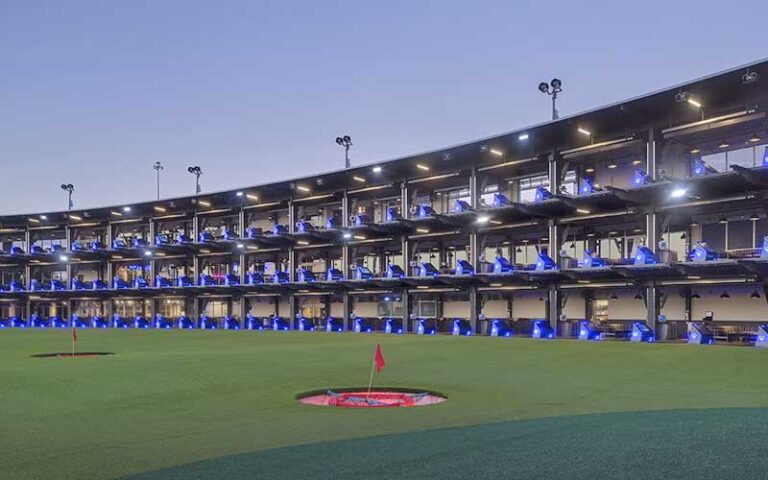 three floor bays facing green with hole targets at topgolf tampa