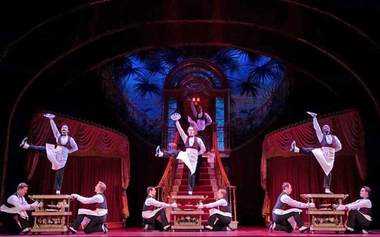 three waiters dancing for hello dolly on stage at straz center for the performing arts tampa