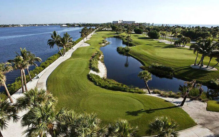 aerial over hole with water hazards and sand traps at palm beach par 3 golf course