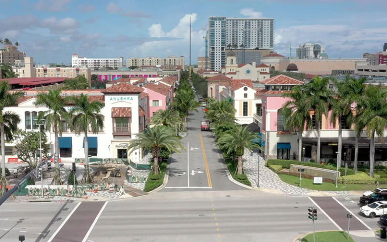 aerial view above streets of shopping district at the square west palm beach