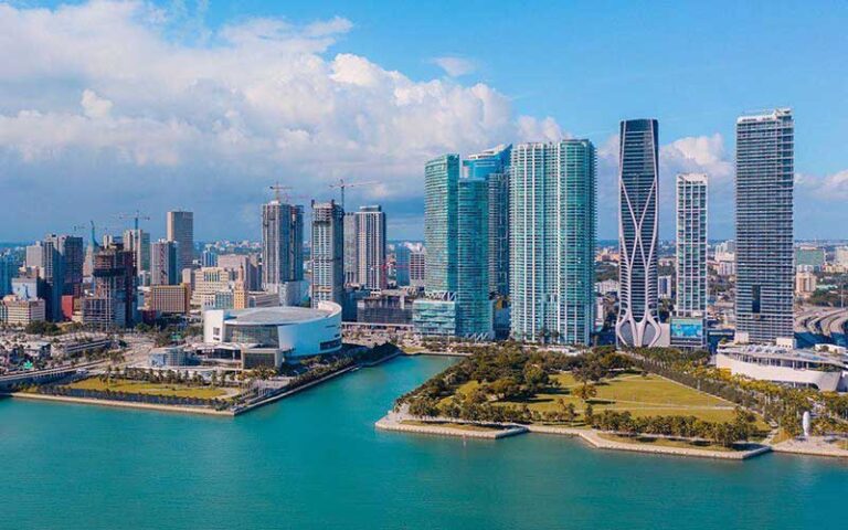 aerial view over biscayne bay of skyline with arena and skyscrapers at kaseya center miami