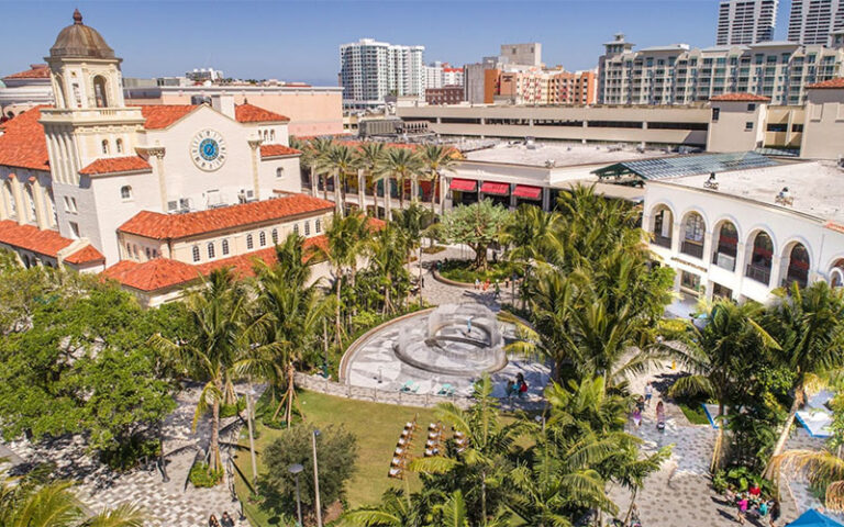 aerial view over park area with church and shops at the square west palm beach