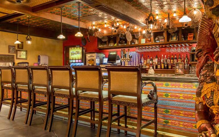 bar with chairs at yak and yeti restaurant disney animal kingdom