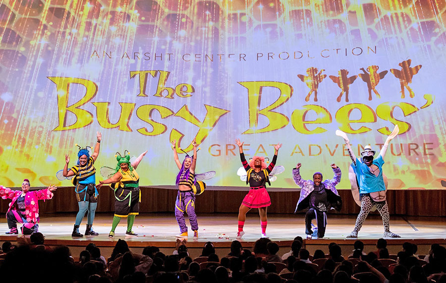 costumed kids show performers busy bees on stage at arsht center miami