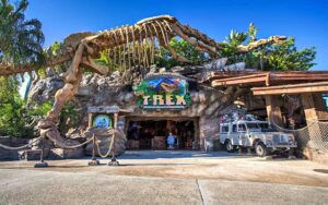 daytime front exterior of cave like entrance with dinosaur skeleton at t rex cafe disney springs orlando