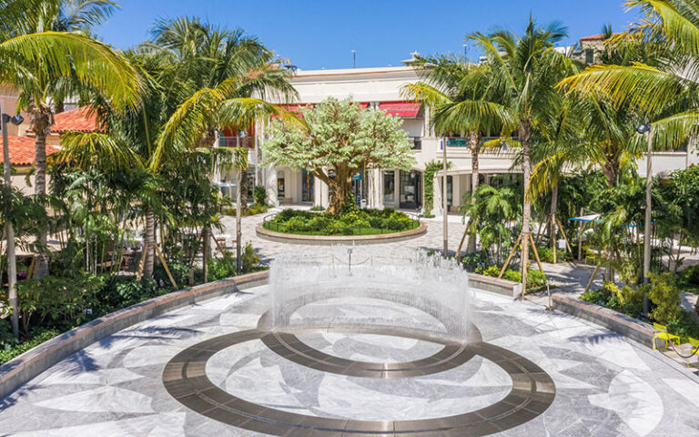 ellipse shaped courtyard with fountain and tree at the square west palm beach