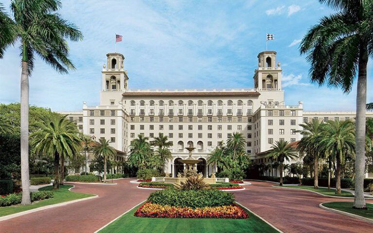 exterior of resort with fountain and driveway at the spa at the breakers palm beach