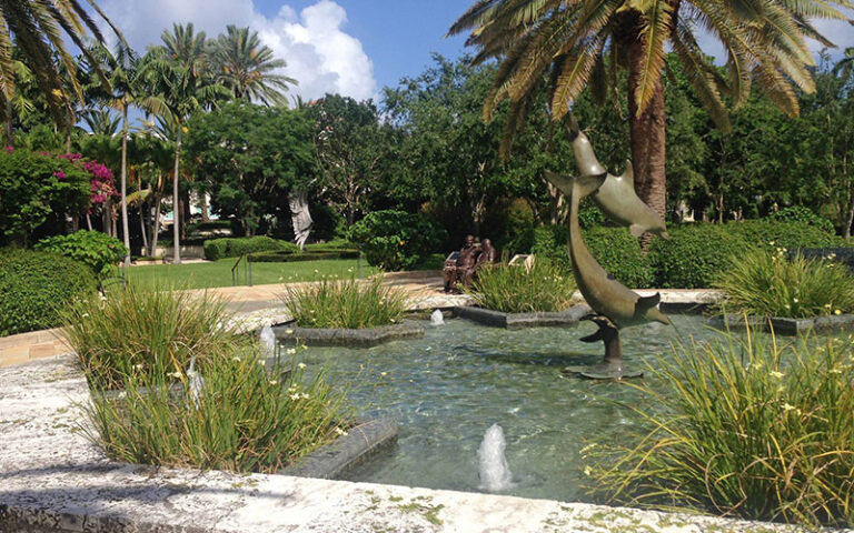 garden with sculptures and fountain at society of the four arts palm beach
