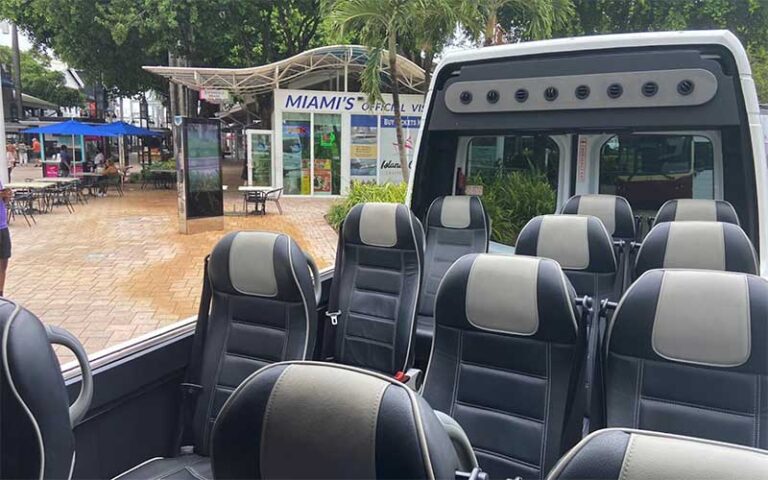 luxury seats in open top van with visitor center on beach at open miami bus tours