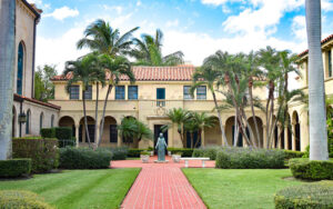 spanish colonial style courtyard with saint figure statue at st edward roman catholic church palm beach