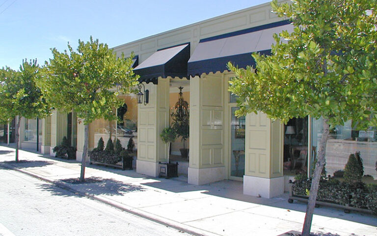 storefront along street with awning at west palm beach antique row art design district