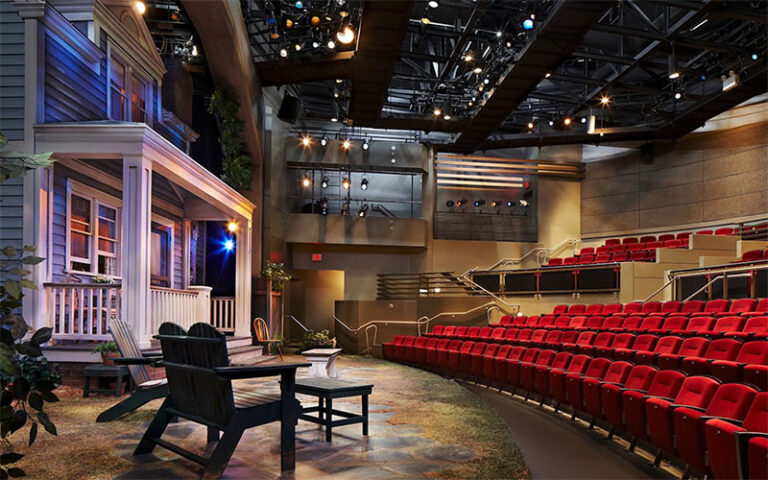 theater with house setting on stage and red seating at palm beach dramaworks west palm beach