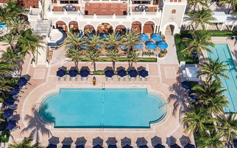 aerial view of multiple pools around hotel at the breakers palm beach