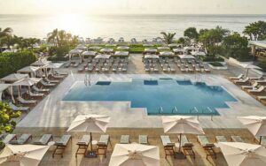 aerial view of pool and beach with cabanas at the four seasons palm beach