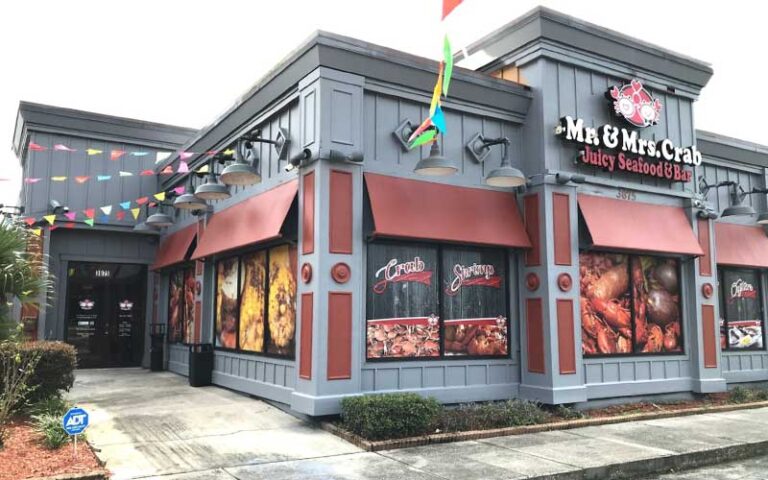 daytime exterior of restaurant with sign at mr mrs crab juicy seafood bar orlando kirkman