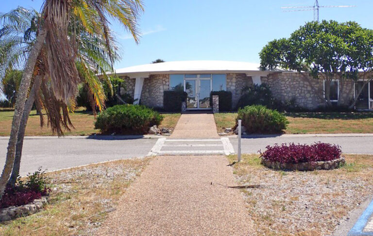 daytime exterior of visitor center with trees at fort de soto park st pete