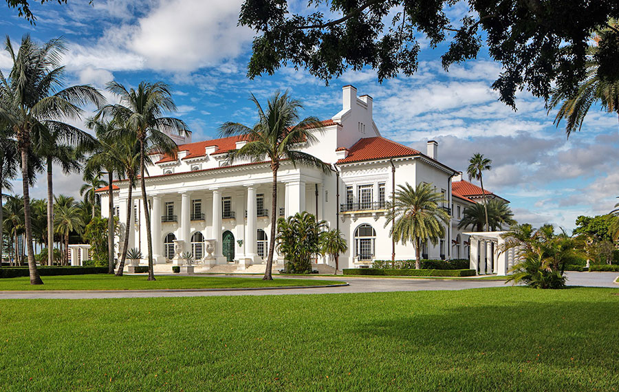daytime exterior with blue sky and green grass of henry morrison flagler museum palm beach