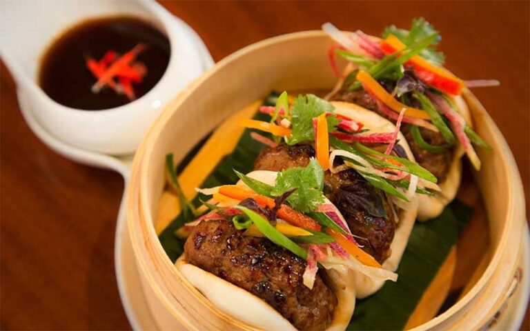 dim sum appetizer with sauce on tabletop at hmf the breakers palm beach