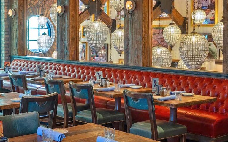 dining room interior with red leather booth seating and crystal pendant lighting at elisabettas ristorante west palm beach