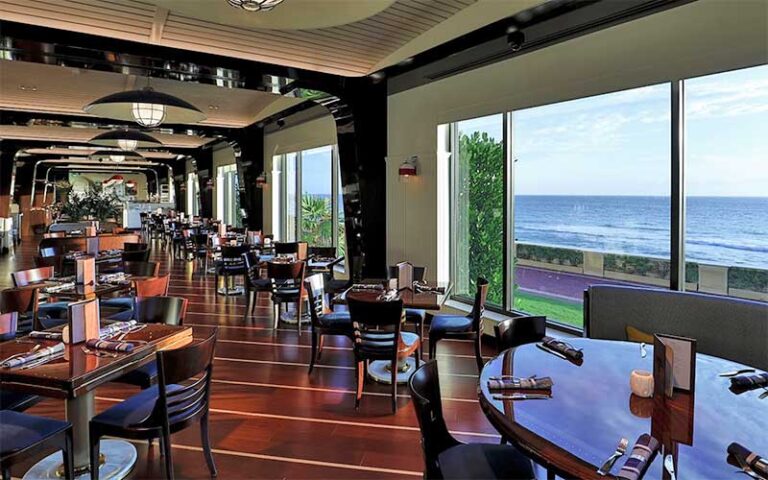 dining room with window view of ocean at seafood bar the breakers palm beach