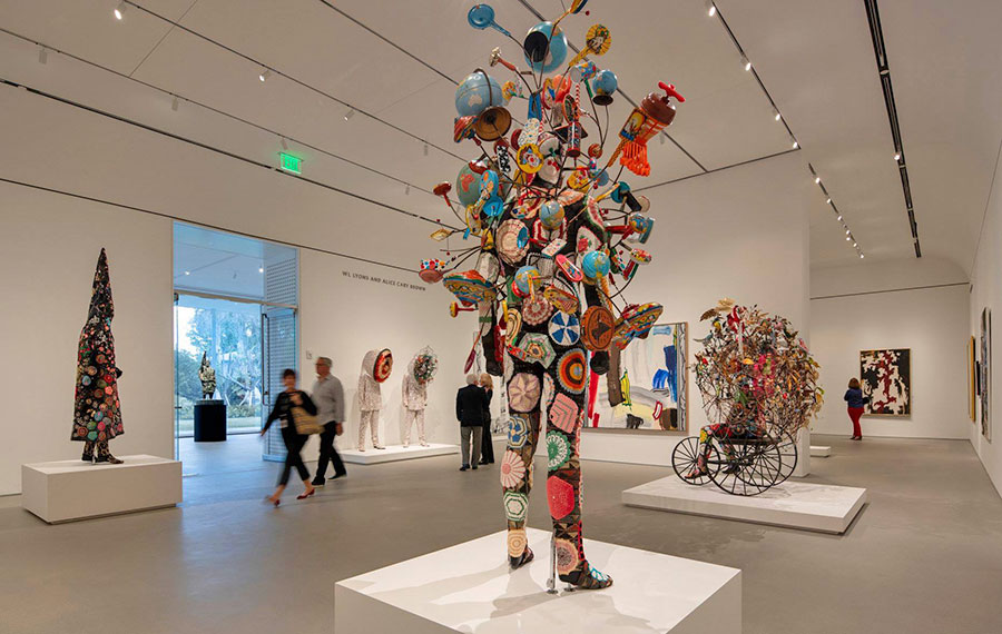 exhibit gallery with sculpted modern figures and patrons norton museum of art west palm beach