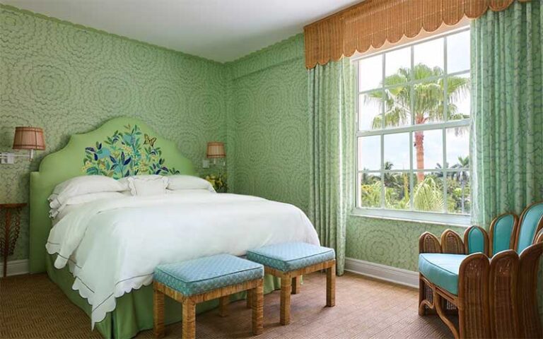 guest room with green accents at the colony palm beach
