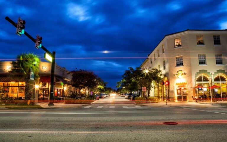 long exposure night view of street corner with shops at northwood village west palm beach