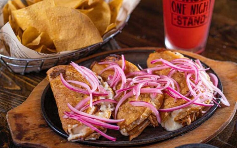 melty tacos with chips and red drink at one night taco stand jacksonville