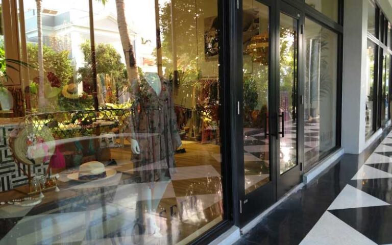 shop windows reflecting with veranda at the royal poinciana plaza palm beach