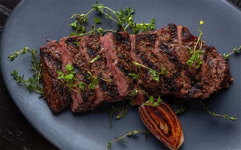 sliced sirloin with garnish at proper grit west palm beach