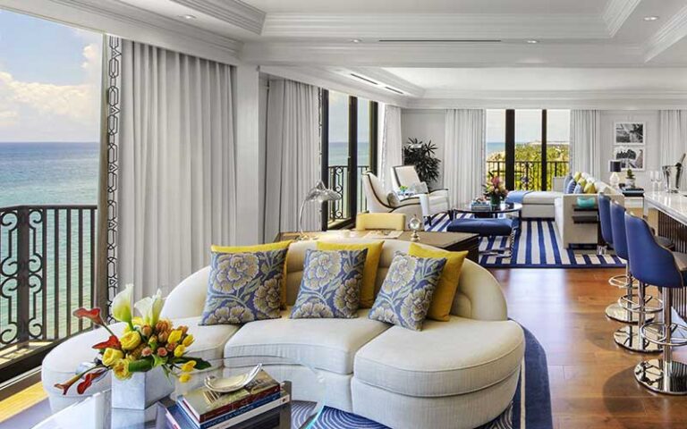 suite with colorful furnishings and balconies with ocean view at the breakers palm beach