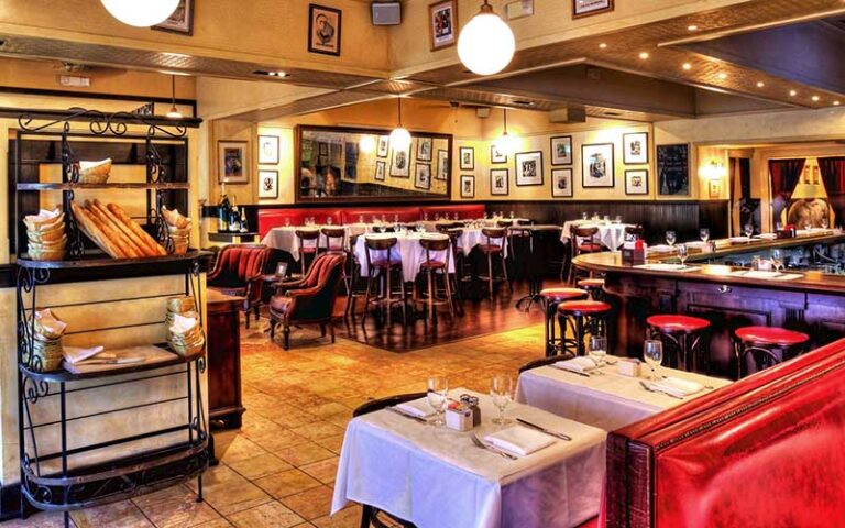 warm red dining room interior at pistache french bistro west palm beach