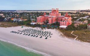 aerial view of beachfront resort with rows of lounges at the don cesar st pete beach