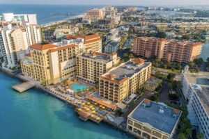 aerial view of high rise hotel on coast at holiday inn suites clearwater beach