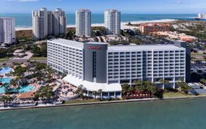 aerial view of high rise hotel with park and beach at clearwater beach marriott suites on sand key